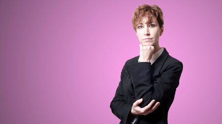 success short hair business woman on pink backgroundの写真素材