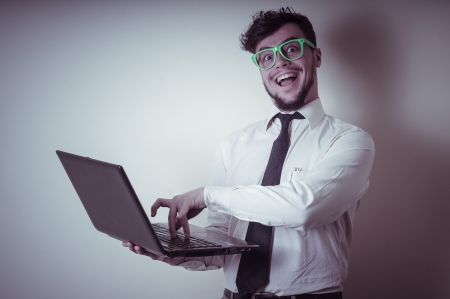 businessman using notebook on gray backgroundの写真素材