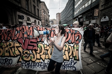 MILAN, ITALY - MAY 1: labor day held in Milan on May 1, 2013. Every year thousands of people taking to the streets to celebrate labor day and to protest against italian austerityのeditorial素材