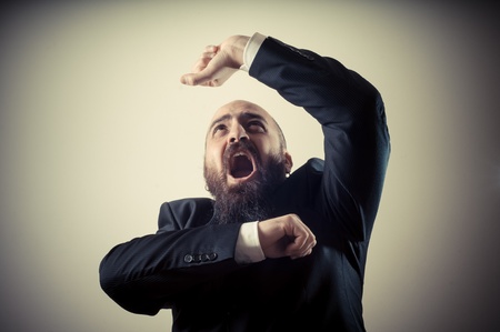 funny afraid elegant bearded man on vignetting backgroundの写真素材