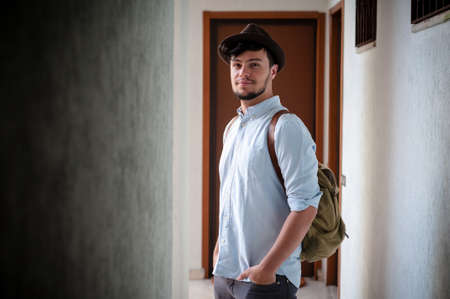 hipster young man posing in a hallwayの写真素材