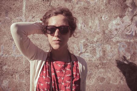 eastern hipster vintage woman with shades at the parkの写真素材