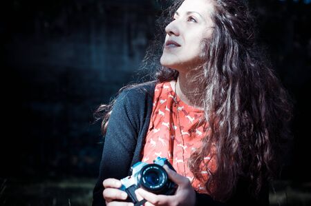 hipster vintage woman with old camera in the park