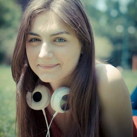 beautiful model young woman in the park in springの写真素材