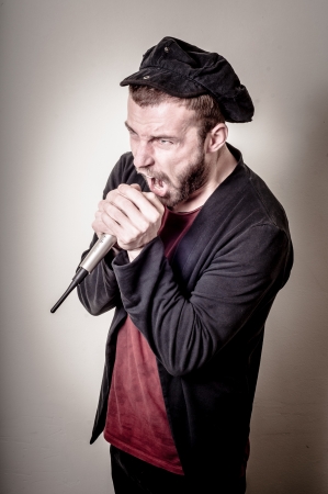 hipster stylish singer on gray backgroundの写真素材