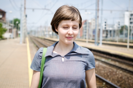 young beautiful hipster woman in stationの写真素材