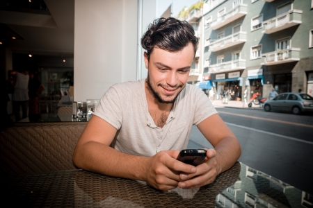 young stylish man at the bar drinking coffeeの写真素材