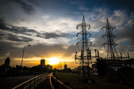 electricity poles in the city on sunrise
