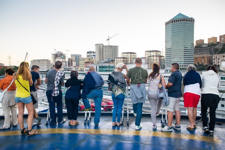 GENOA, ITALY - AGOUST 10: View of Port of Genoa from docked ship on August, 10 2013. the port of Genoa is the largest industrial and commercial italian port.People looking port from ship waiting for departure.のeditorial素材