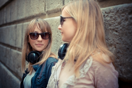 two beautiful blonde women in the cityの写真素材
