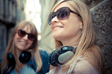 two beautiful blonde women in the cityの写真素材