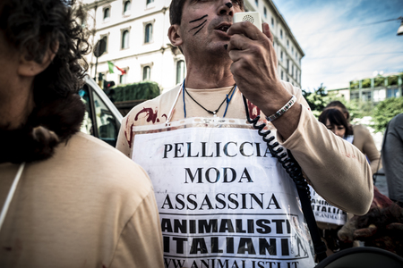 MILAN, ITALY - SEPTEMBER 17: Animalisti Italiani protest on September 17, 2013. Animal right association 'Animalisti Italiani' protest against furs and fashion, in famous fashion Milan street Monte Napoleoneのeditorial素材