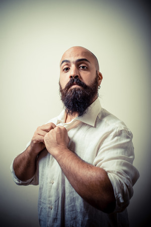 long beard and mustache man with white shirt isolated on grayの写真素材