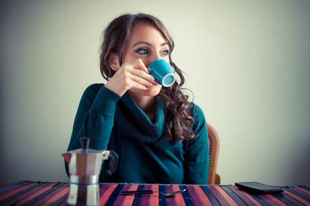 beautiful woman having breakfast at homeの写真素材