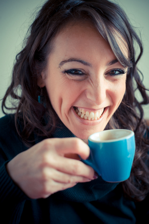 beautiful woman having breakfast at homeの写真素材