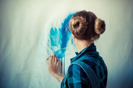 beautiful blonde woman painter in her studioの写真素材