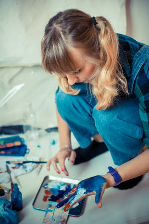 beautiful blonde woman painter in her studioの写真素材