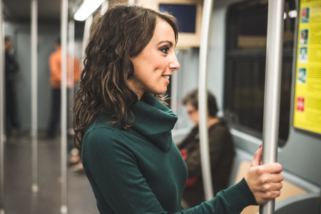 beautiful woman with turtleneck on underground in autumnの写真素材