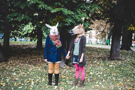 horse and rabbit mask women in the park autumnの写真素材