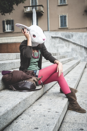 rabbit head woman in the cityの写真素材