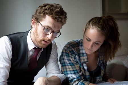 business blonde hipster couple working at homeの写真素材