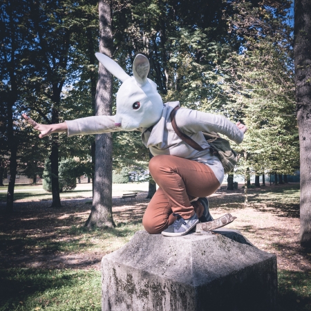 young hipster rabbit mask woman in the woodland autumnの写真素材