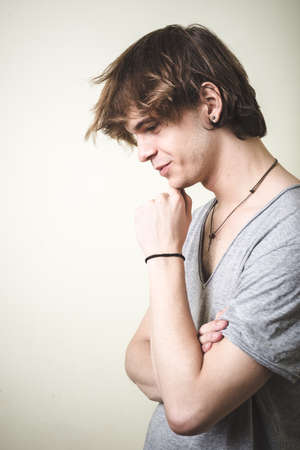 stylish young blonde hipster man on white backgroundの写真素材