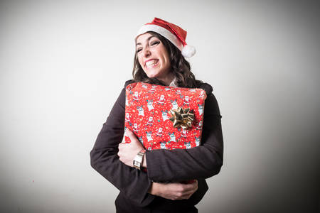 christmas businesswoman with gift on white background