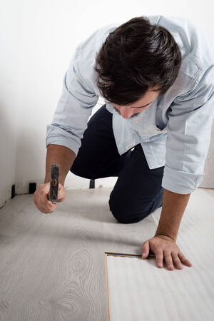 young man bricolage working at homeの写真素材