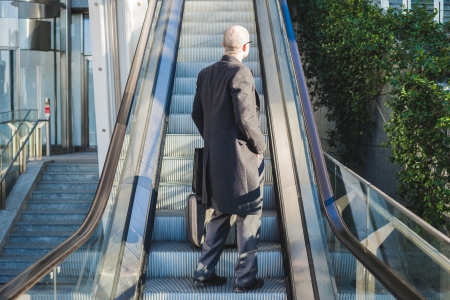 successful elegant fashionable businessman in business district