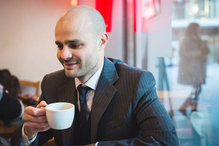 successful elegant fashionable businessman in business districtの写真素材