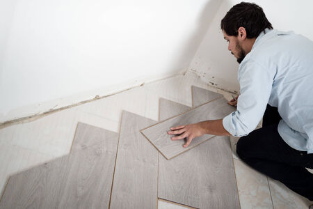 young man bricolage working at homeの写真素材