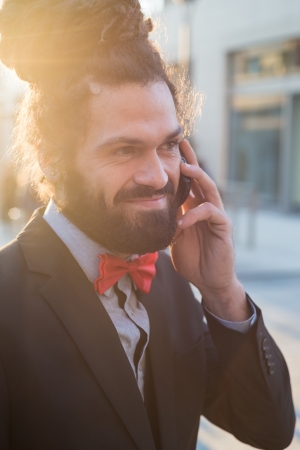 Stylish elegant dreadlocks businessman in business landscapeの写真素材