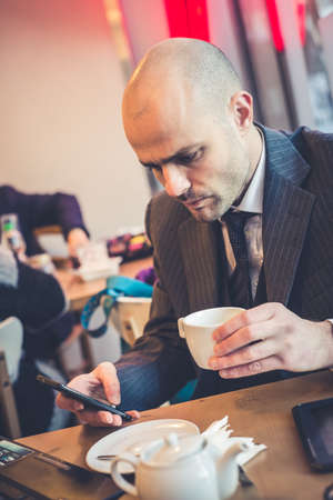 successful elegant fashionable businessman in business districtの写真素材