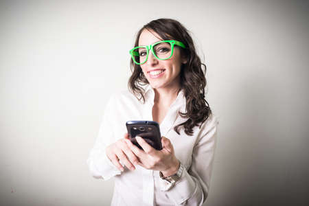 beautiful young businesswoman on gray の写真素材