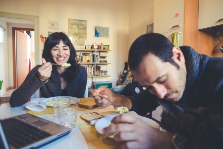 couple in love eating lunch at homeの写真素材