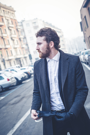 handsome bearded hipster elegant man in the cityの写真素材