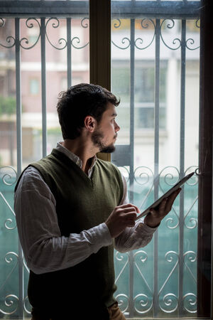 young stylish man lifestyle using tablet at homeの写真素材