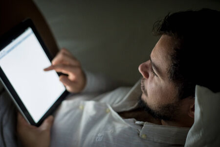 young stylish man lifestyle using tablet at homeの写真素材