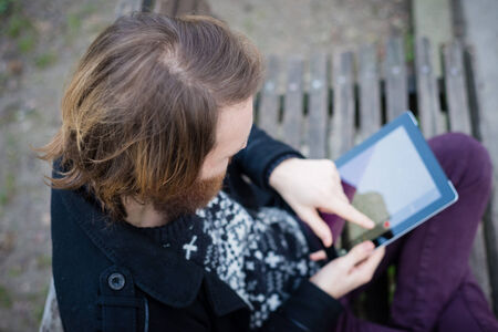 young hipster red bearded man at the parkの写真素材