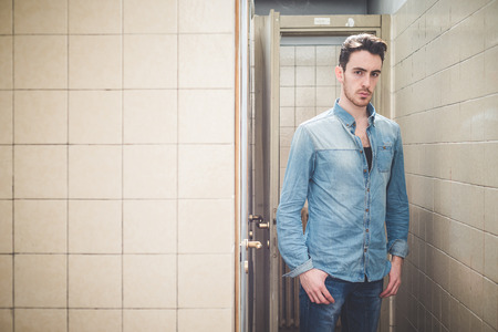 young handsome fashion model man outdoorsの写真素材