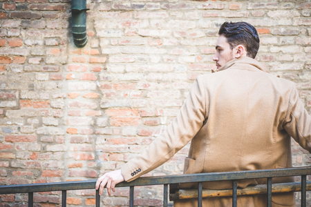 young handsome fashion model man outdoorsの写真素材