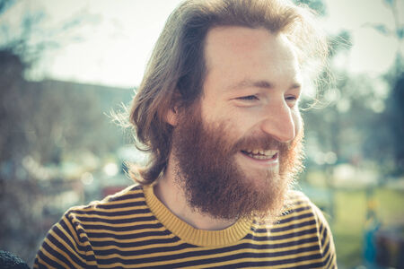 young bearded stylish handsome hipster man outdoors
