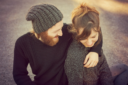 young couple in love lifestyle outdoor using tablet at the parkの写真素材