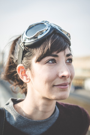 young beautiful hipster woman success aviator glasses  in the cityの写真素材
