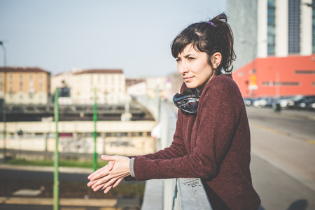young beautiful hipster woman success aviator glasses  in the cityの写真素材