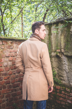 young handsome fashion model man outdoorsの写真素材