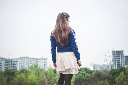 beautiful woman in a desolate lurban landscapeの写真素材