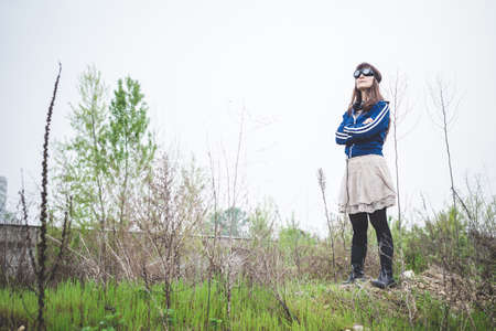 beautiful woman in a desolate lurban landscapeの写真素材