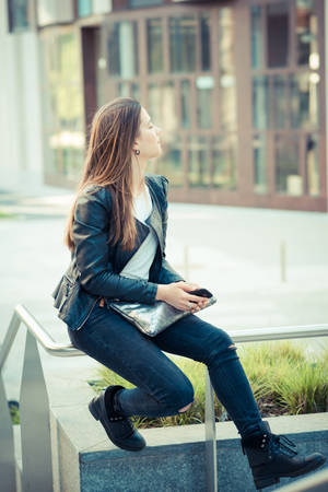 young beautiful woman using smart phone in the cityの写真素材